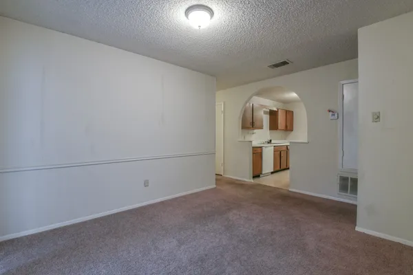 a view of a big room with closet and wooden floor