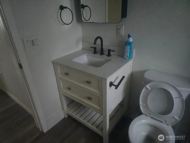 a bathroom with a toilet and a sink