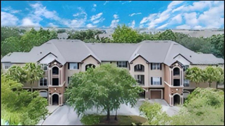 a aerial view of a house with a yard and plants