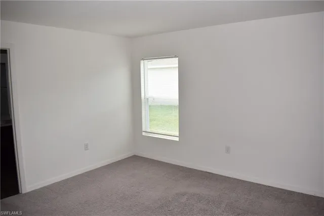 an empty room with window