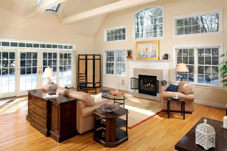 50 Woods Neck Road Orleans, MA 02653 - Photo 1 of 22 a living room with furniture fireplace and a large window