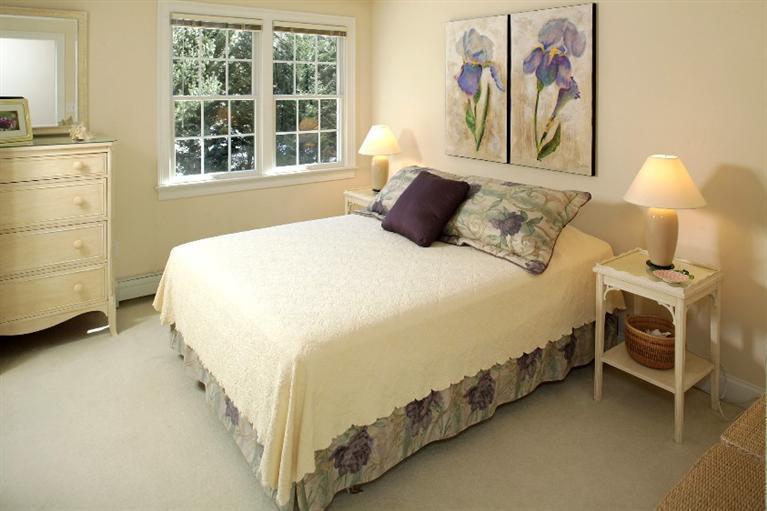 50 Woods Neck Road Orleans, MA 02653 - Photo 11 of 22 a bedroom with a bed and a window