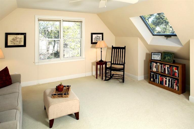 50 Woods Neck Road Orleans, MA 02653 - Photo 14 of 22 a living room with furniture and a book shelf