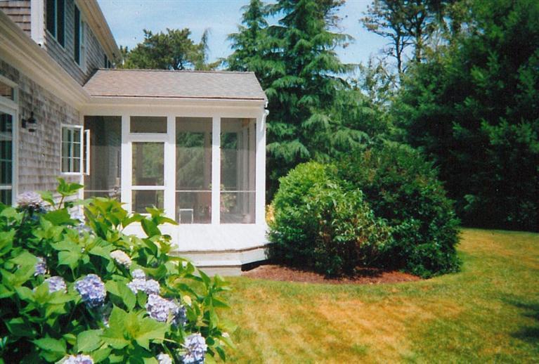 50 Woods Neck Road Orleans, MA 02653 - Photo 19 of 22 a house with a flower garden in front of it