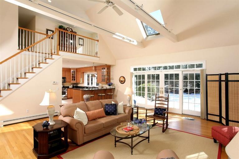 50 Woods Neck Road Orleans, MA 02653 - Photo 2 of 22 a living room with furniture and a large window