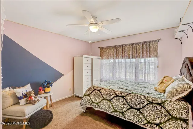 a bedroom with furniture and a window