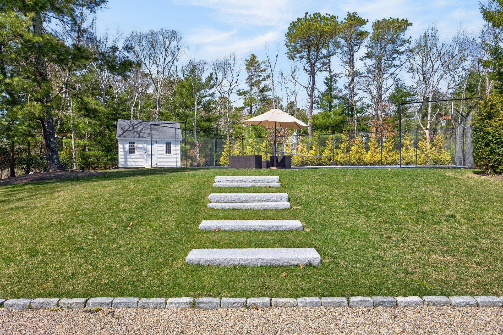 44 Seapuit Road Osterville, MA 02655 - Photo 29 of 33 a front view of a house with a yard and trees