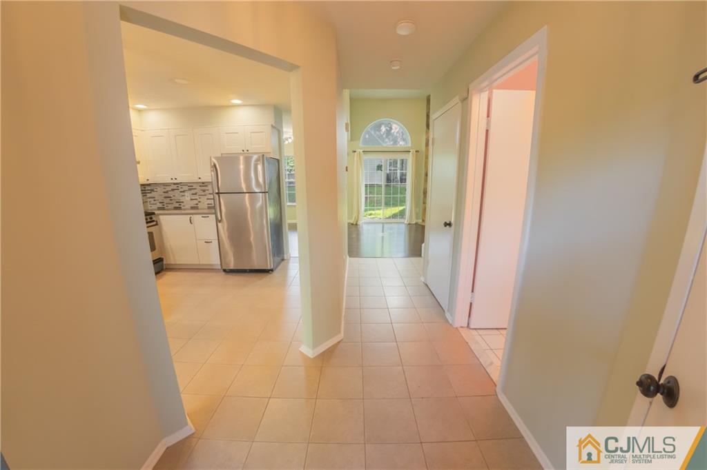 380 Draco Road Piscataway, NJ 08854 - Photo 12 of 35 a view of a hallway with a kitchen