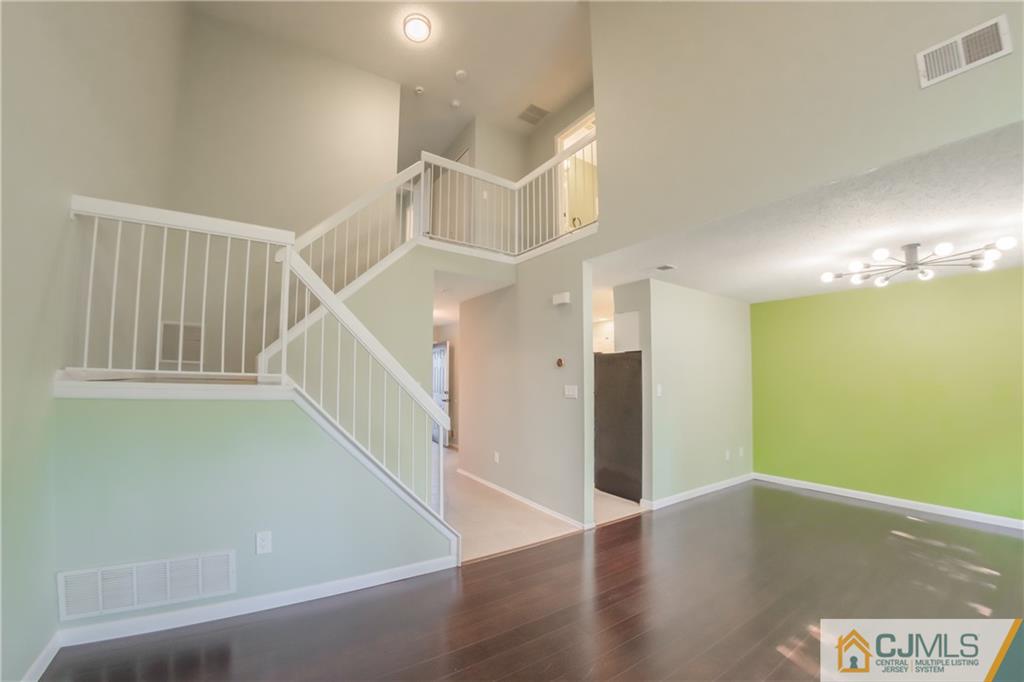 380 Draco Road Piscataway, NJ 08854 - Photo 18 of 35 a view of a hallway with wooden floor and entryway
