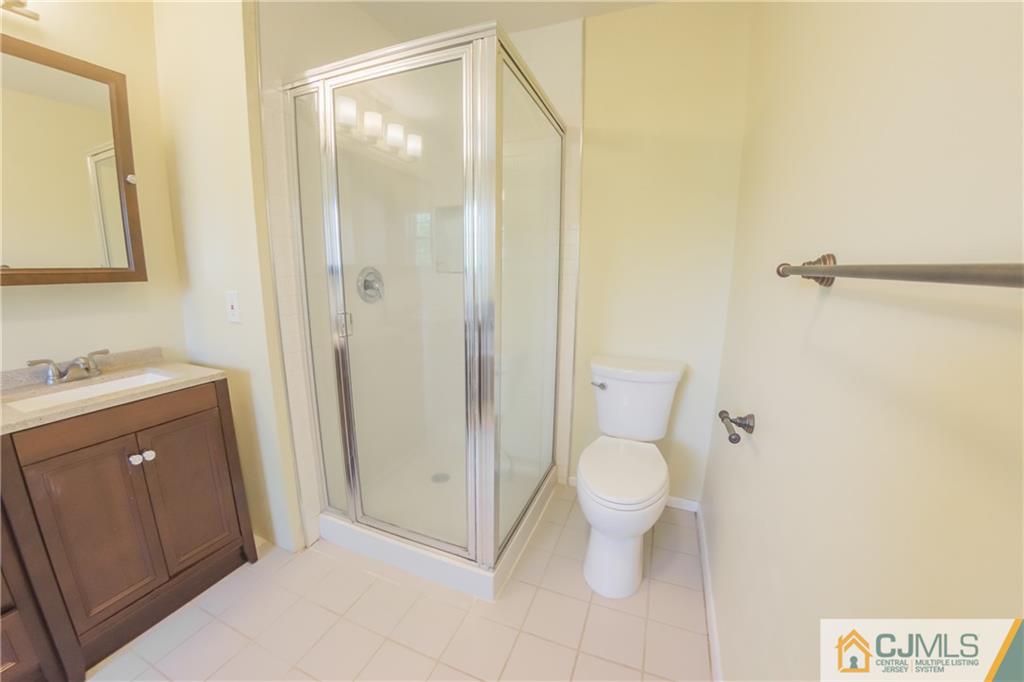 380 Draco Road Piscataway, NJ 08854 - Photo 32 of 35 a bathroom with a granite countertop sink toilet and shower