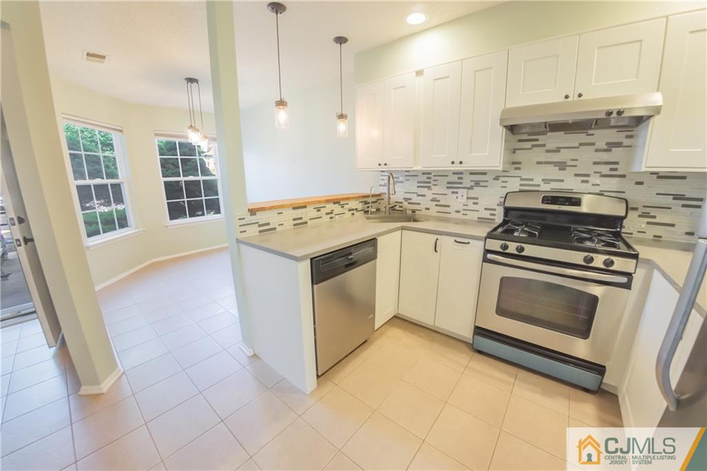 380 Draco Road Piscataway, NJ 08854 - Photo 6 of 35 a kitchen with cabinets and appliances
