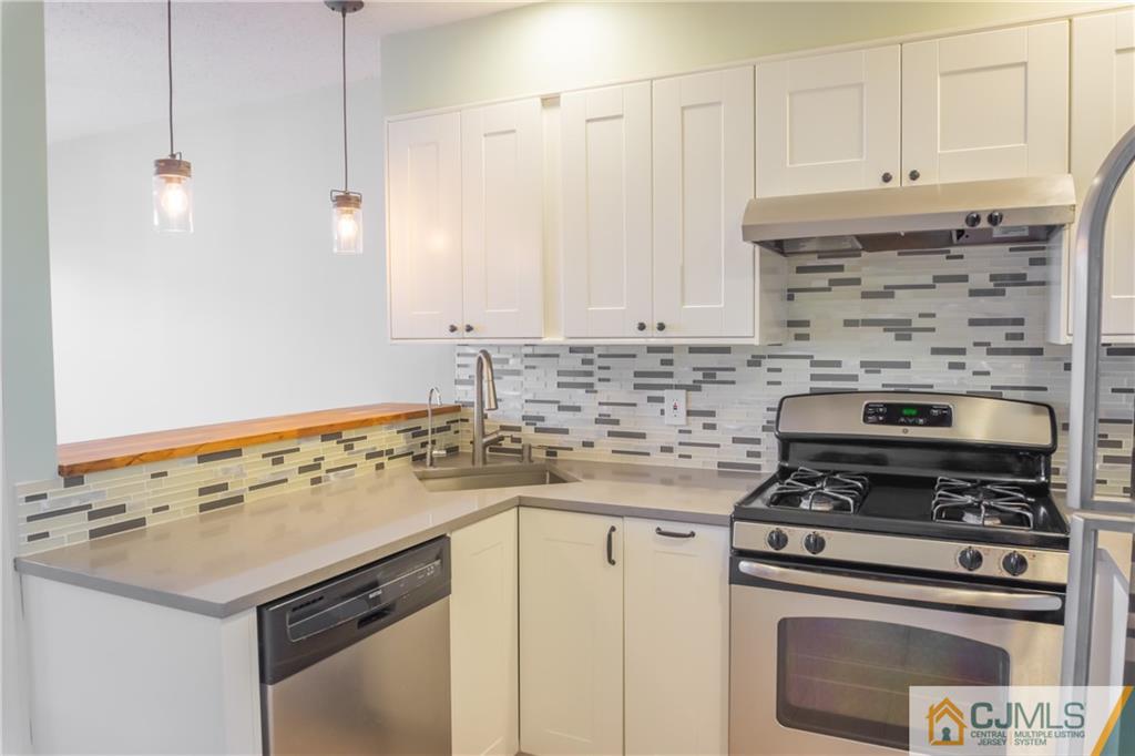 380 Draco Road Piscataway, NJ 08854 - Photo 7 of 35 a kitchen with a stove and a sink