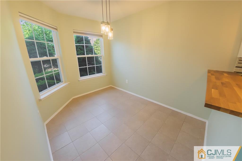 380 Draco Road Piscataway, NJ 08854 - Photo 10 of 35 an empty room with windows