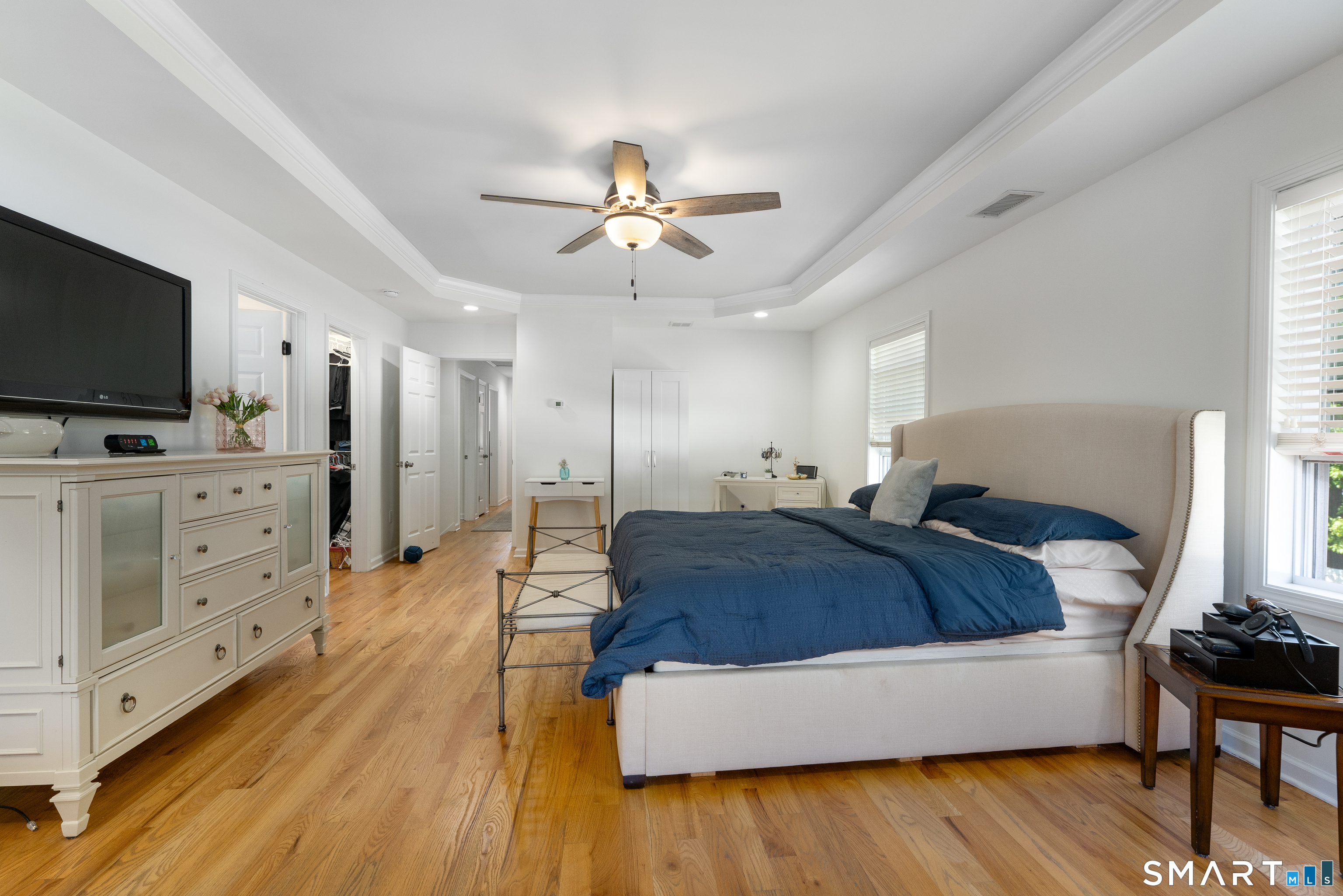 261 Spring Road North Haven, CT 06473 - Photo 24 of 39 a spacious bedroom with a bed and a flat screen tv
