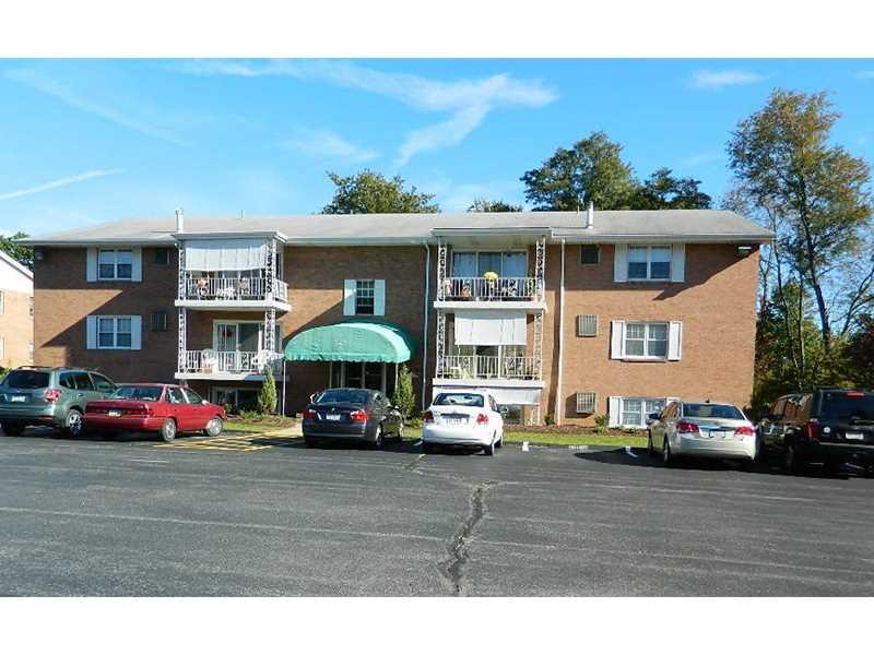 220 Coraopolis Road, Unit E8 Coraopolis, PA 15108 - Photo 1 of 17 Exterior Front. All Brick Building with security locks. Plenty of off Street Parking. Association improvements scheduled for entrance canopy and unit railings.