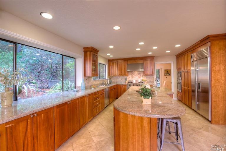 217 Spring Grove Avenue San Rafael, CA 94901 - Photo 1 of 1 a view of a kitchen with kitchen island granite countertop a large window