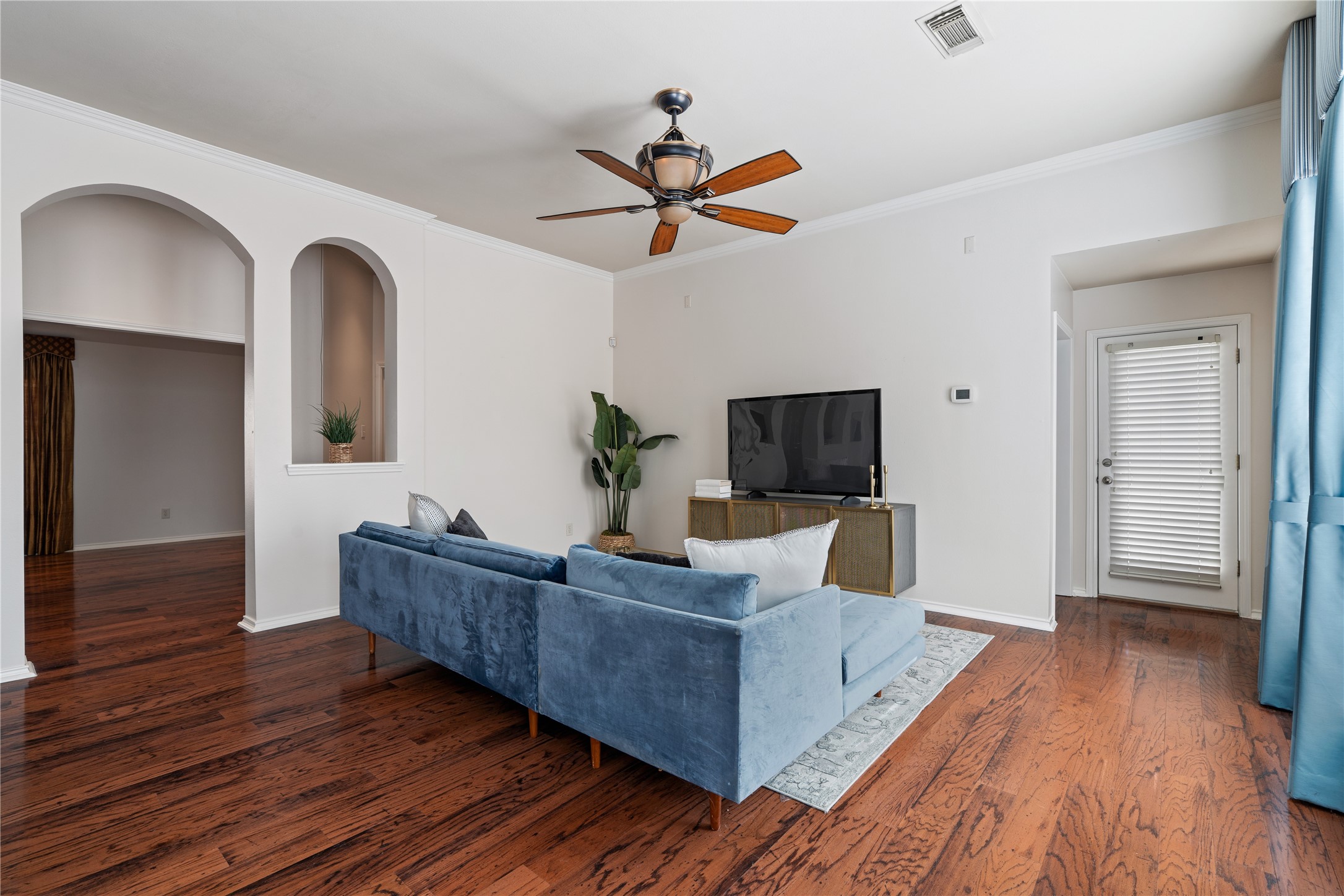 4323 Sunlit Pass Loop Humble, TX 77396 - Photo 11 of 30 a living room with furniture and a flat screen tv