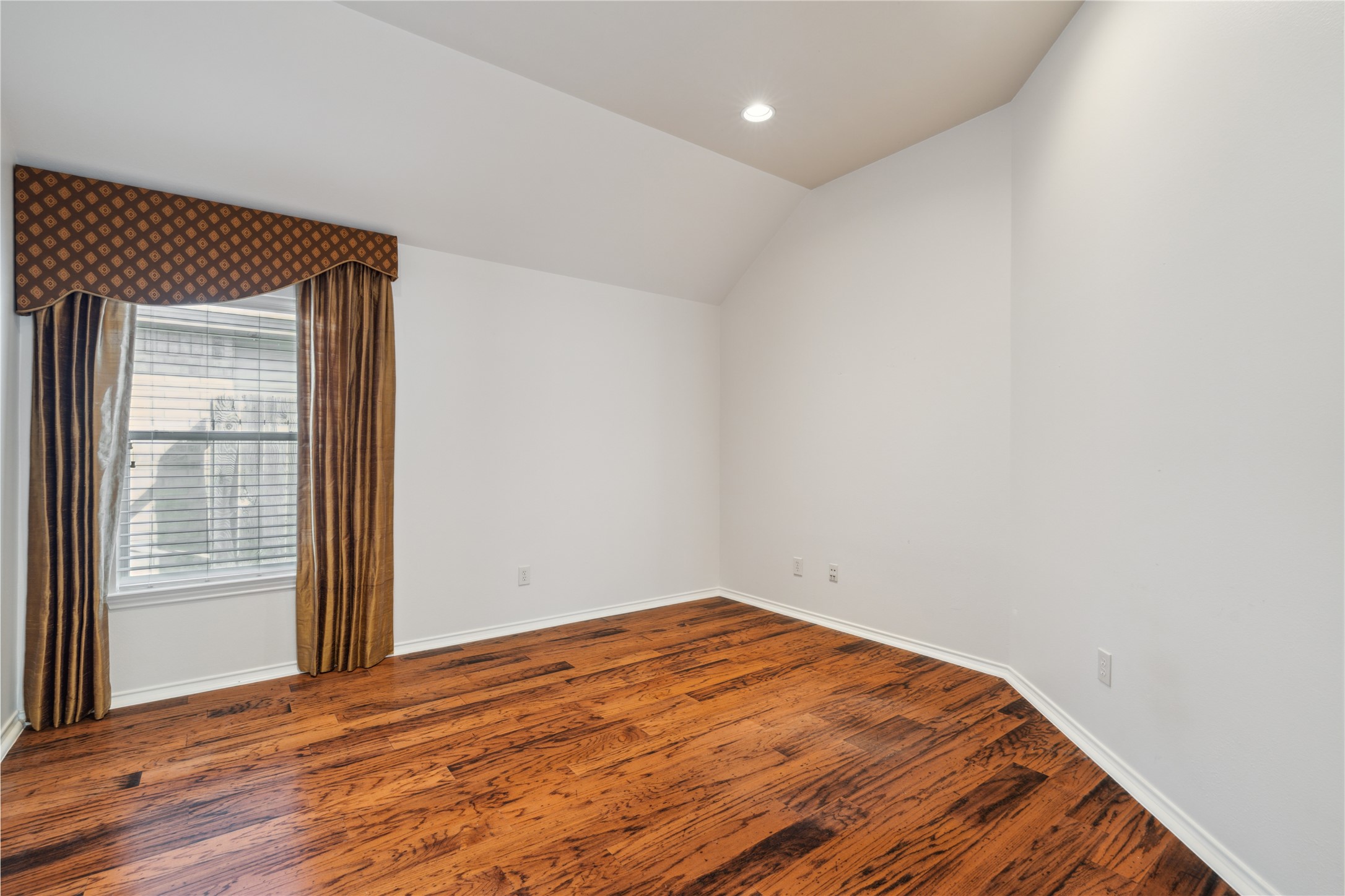 4323 Sunlit Pass Loop Humble, TX 77396 - Photo 14 of 30 an empty room with wooden floor and windows