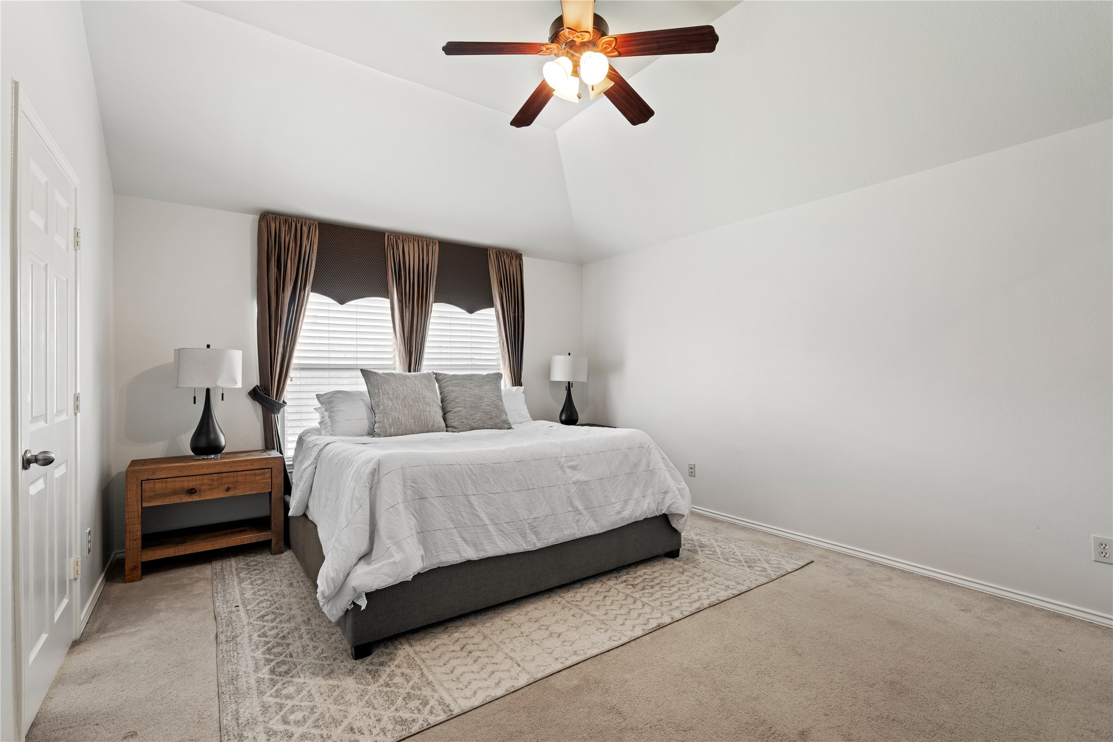 4323 Sunlit Pass Loop Humble, TX 77396 - Photo 16 of 30 a spacious bedroom with a bed and a window