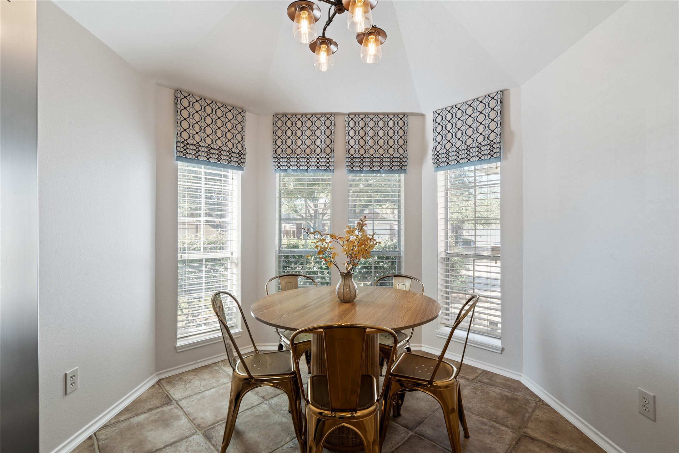 4323 Sunlit Pass Loop Humble, TX 77396 - Photo 6 of 30 a dining room with furniture a chandelier and wooden floor
