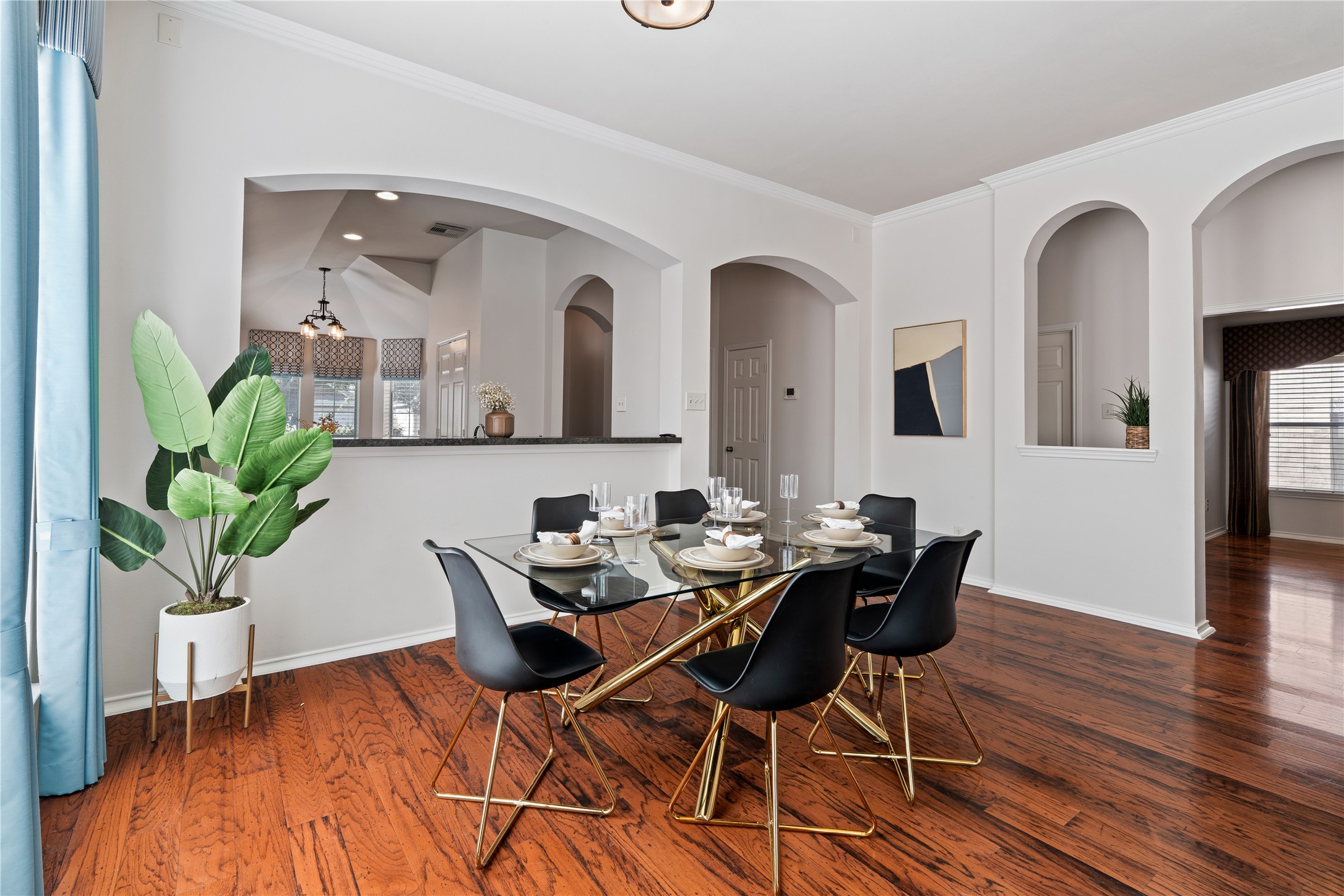 4323 Sunlit Pass Loop Humble, TX 77396 - Photo 8 of 30 a view of a dining room with furniture and wooden floor