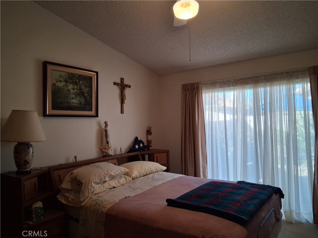 6353 Colonial Avenue Banning, CA 92220 - Photo 12 of 26 a bedroom with a bed and a window