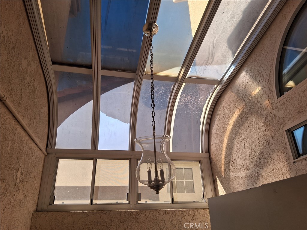 6353 Colonial Avenue Banning, CA 92220 - Photo 19 of 26 a view of staircase with a large window