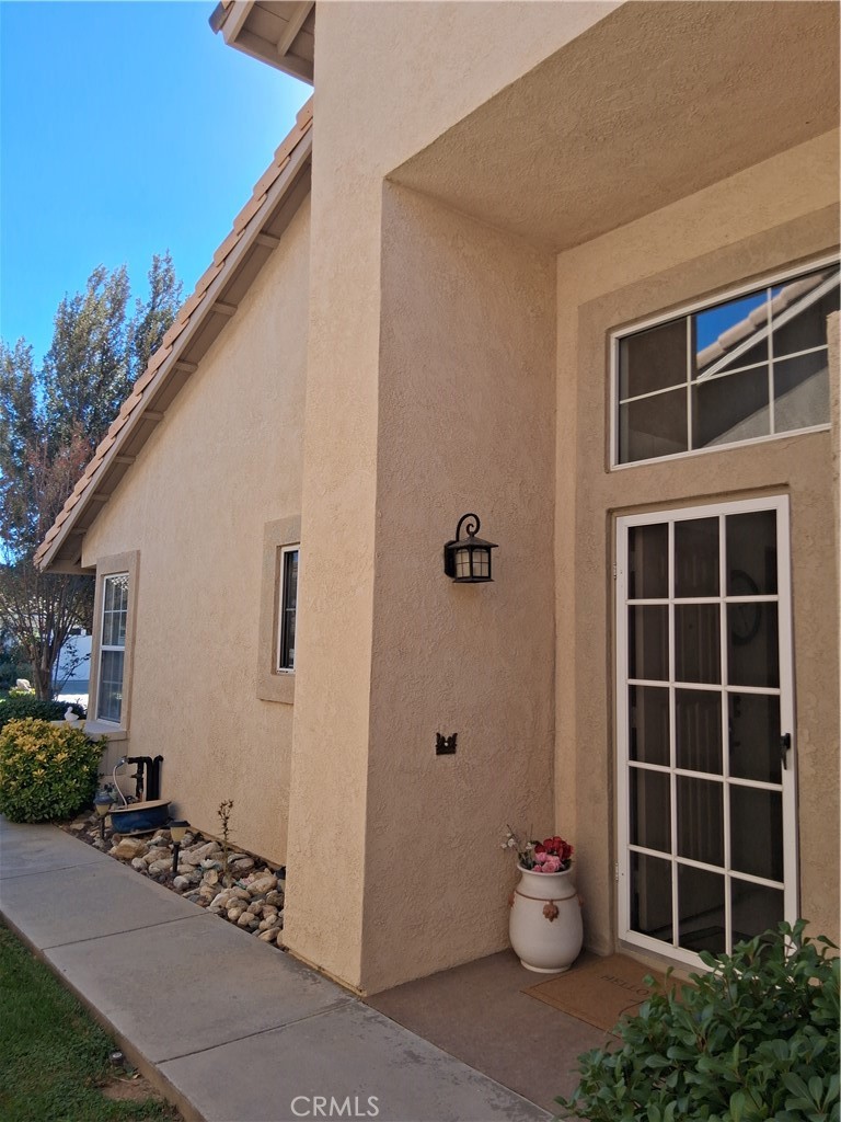 6353 Colonial Avenue Banning, CA 92220 - Photo 20 of 26 a view of front door and potted plants