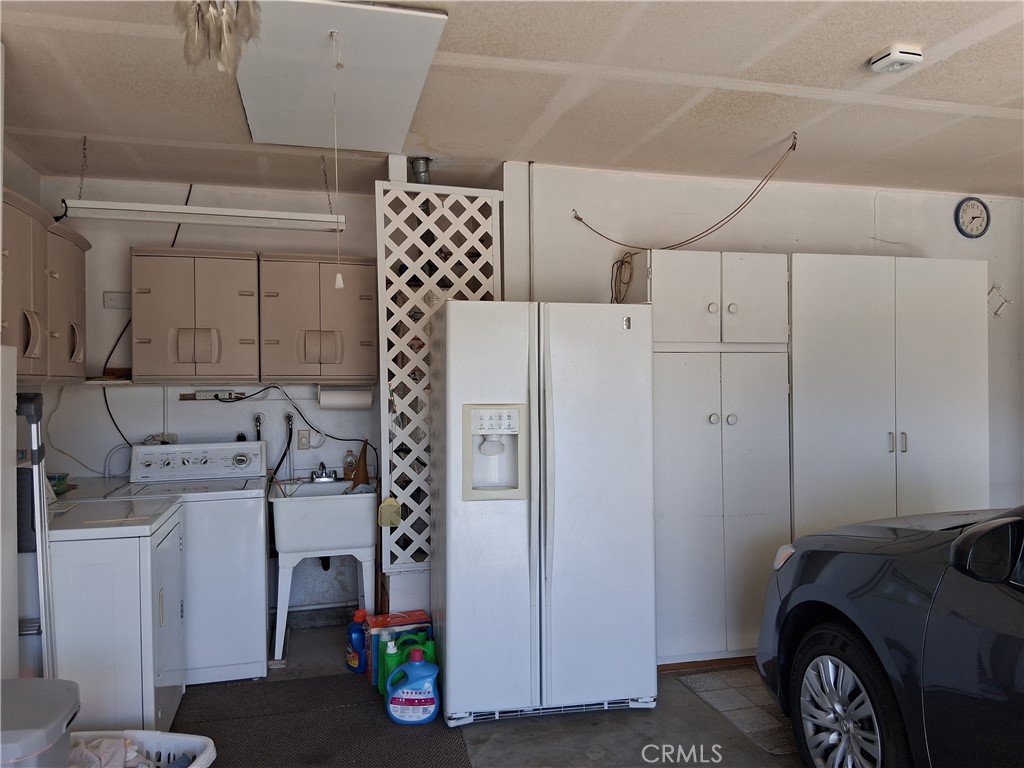 6353 Colonial Avenue Banning, CA 92220 - Photo 23 of 26 a utility room with dryer and washer