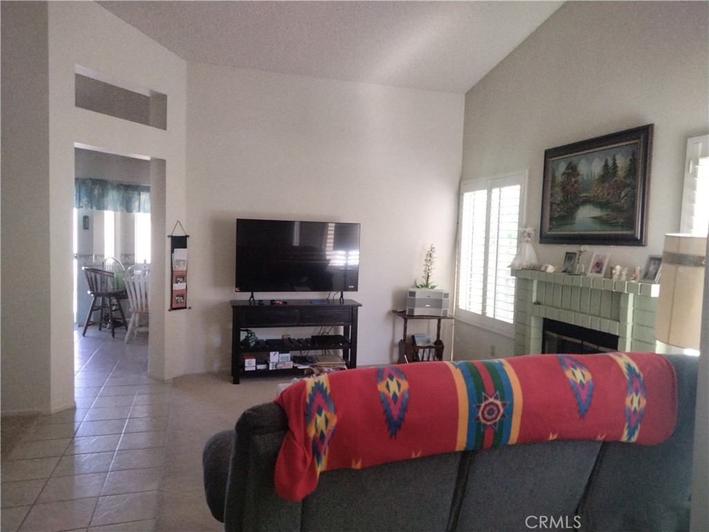 6353 Colonial Avenue Banning, CA 92220 - Photo 7 of 26 a living room with furniture and a flat screen tv