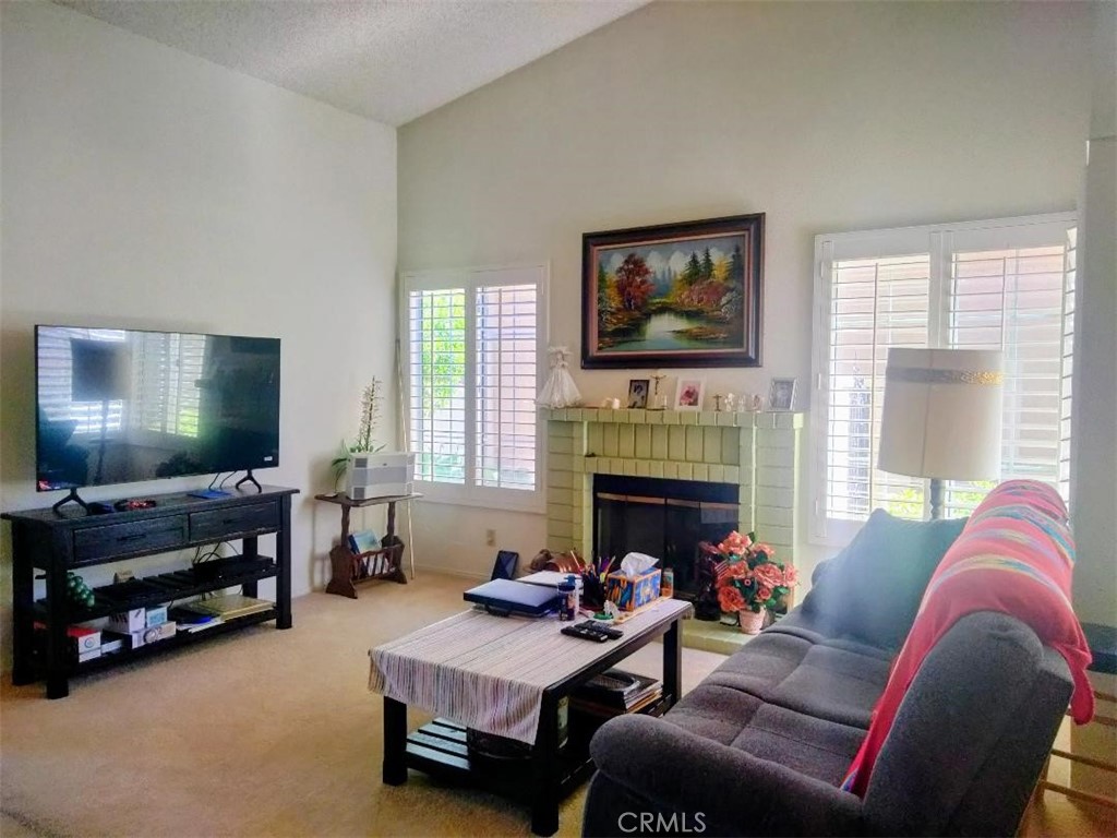 6353 Colonial Avenue Banning, CA 92220 - Photo 8 of 26 a living room with furniture and a flat screen tv