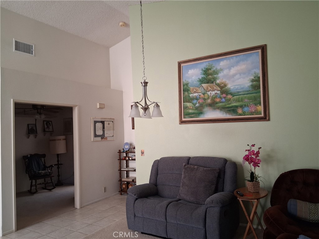 6353 Colonial Avenue Banning, CA 92220 - Photo 10 of 26 a living room with furniture and flowers