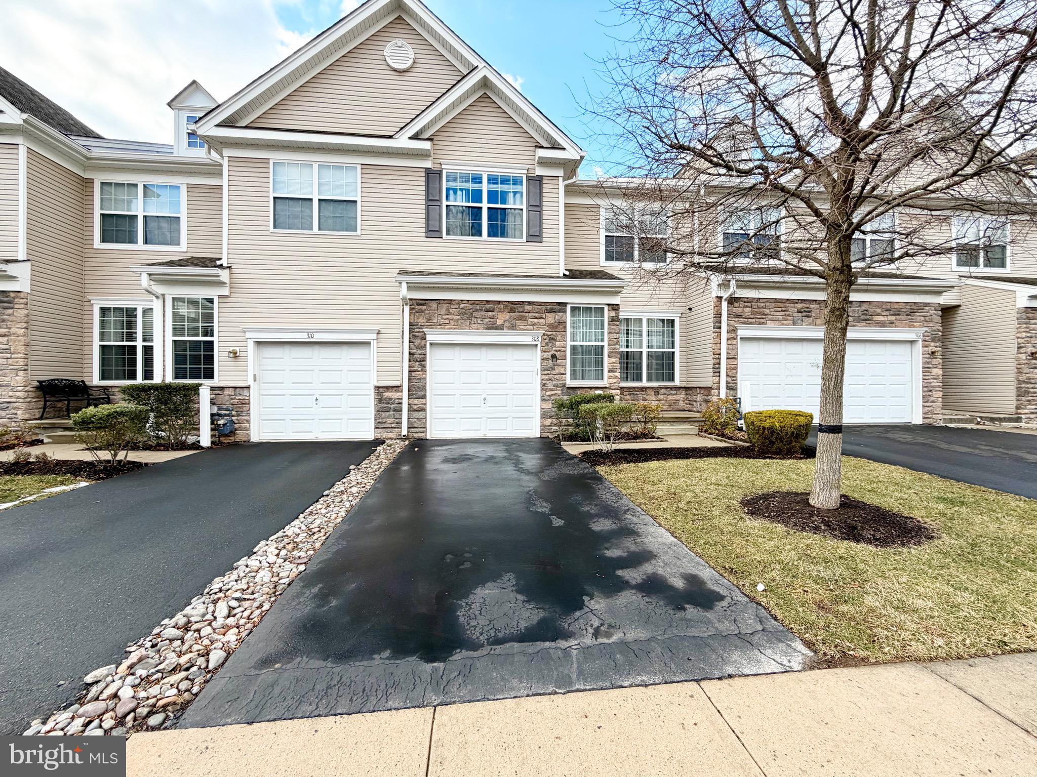 308 Roarks Trail Warminster, PA 18974 - Photo 2 of 68 a front view of a house with a yard