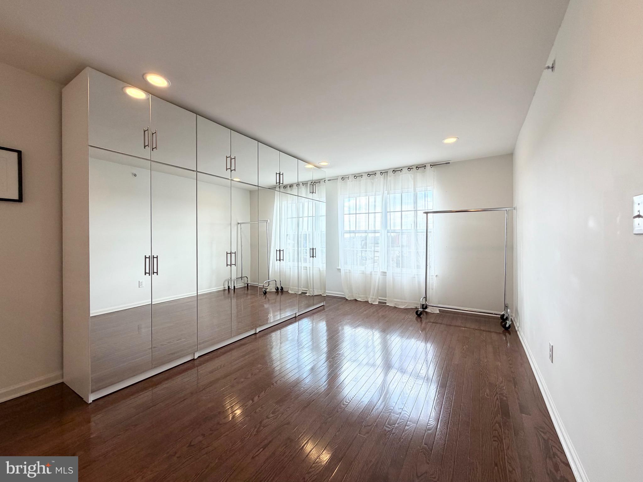 308 Roarks Trail Warminster, PA 18974 - Photo 27 of 68 an empty room with wooden floor and windows