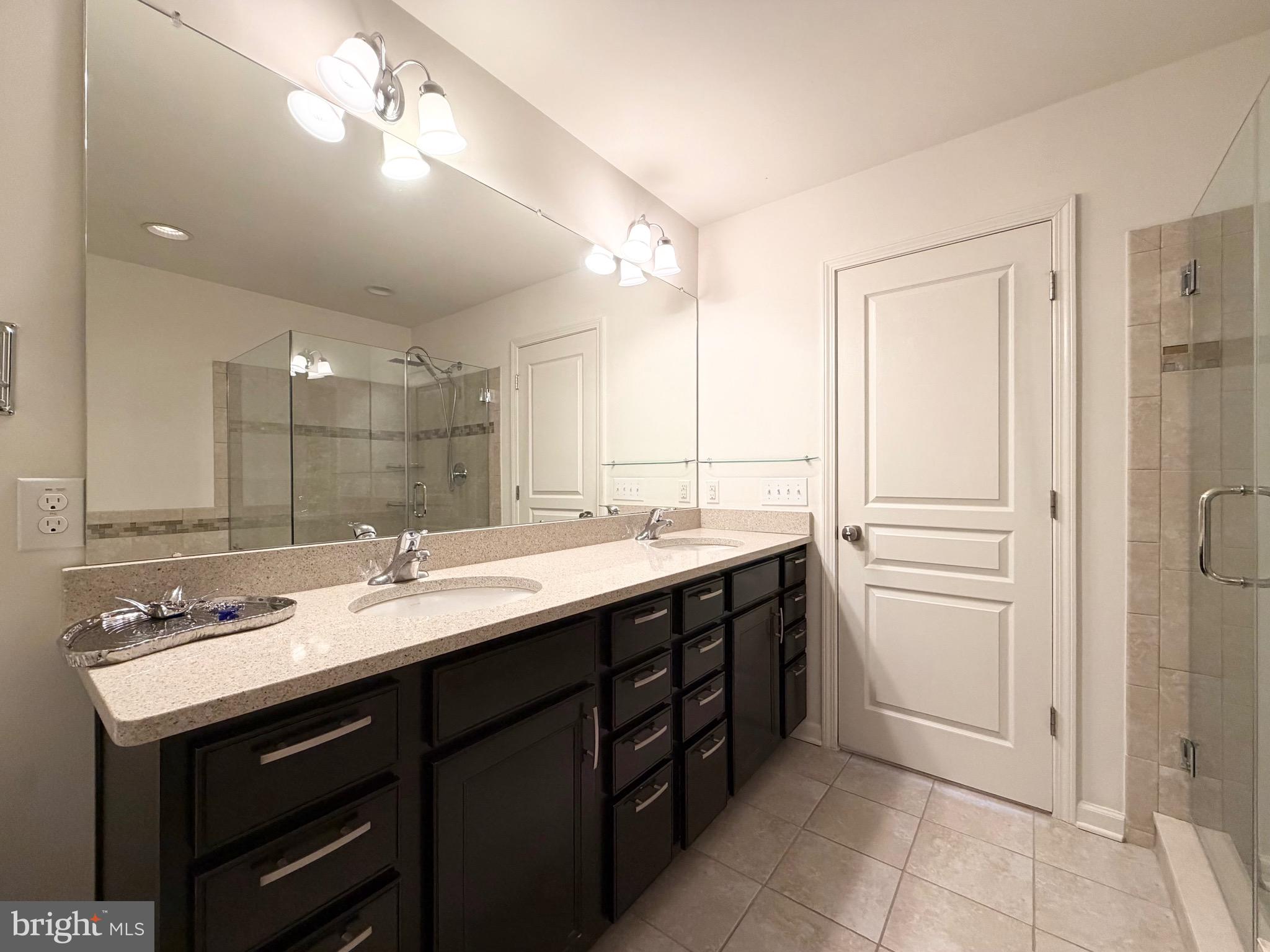 308 Roarks Trail Warminster, PA 18974 - Photo 42 of 68 a bathroom with a sink double vanity and a mirror