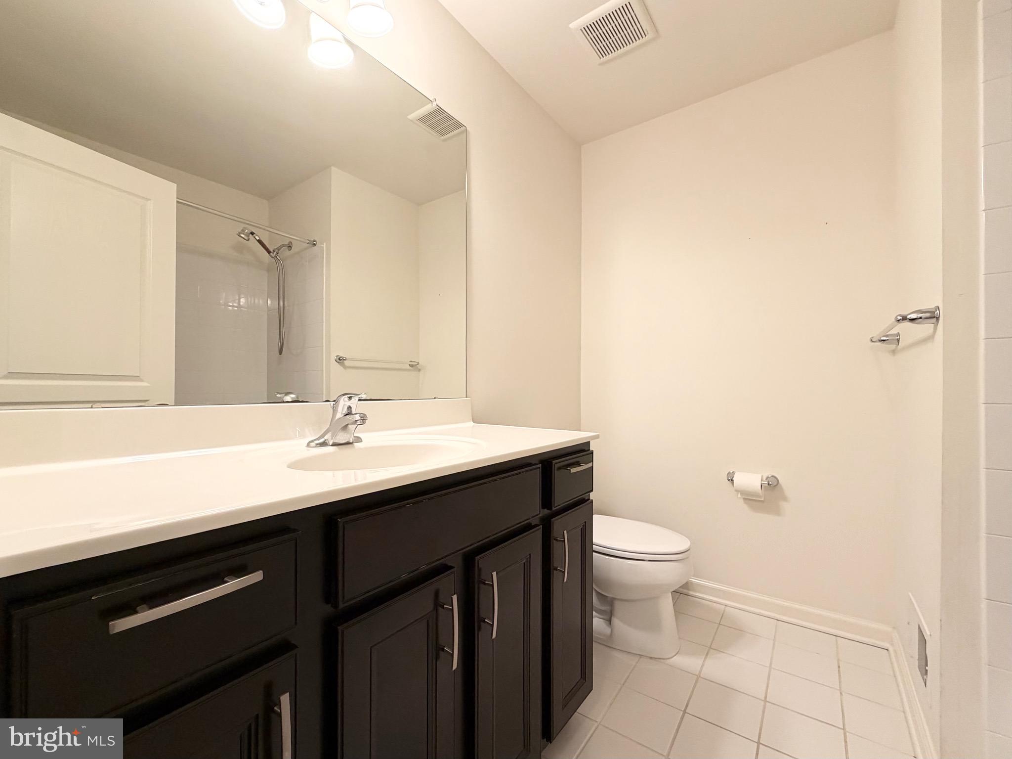308 Roarks Trail Warminster, PA 18974 - Photo 48 of 68 a bathroom with a sink a toilet a shower and a mirror