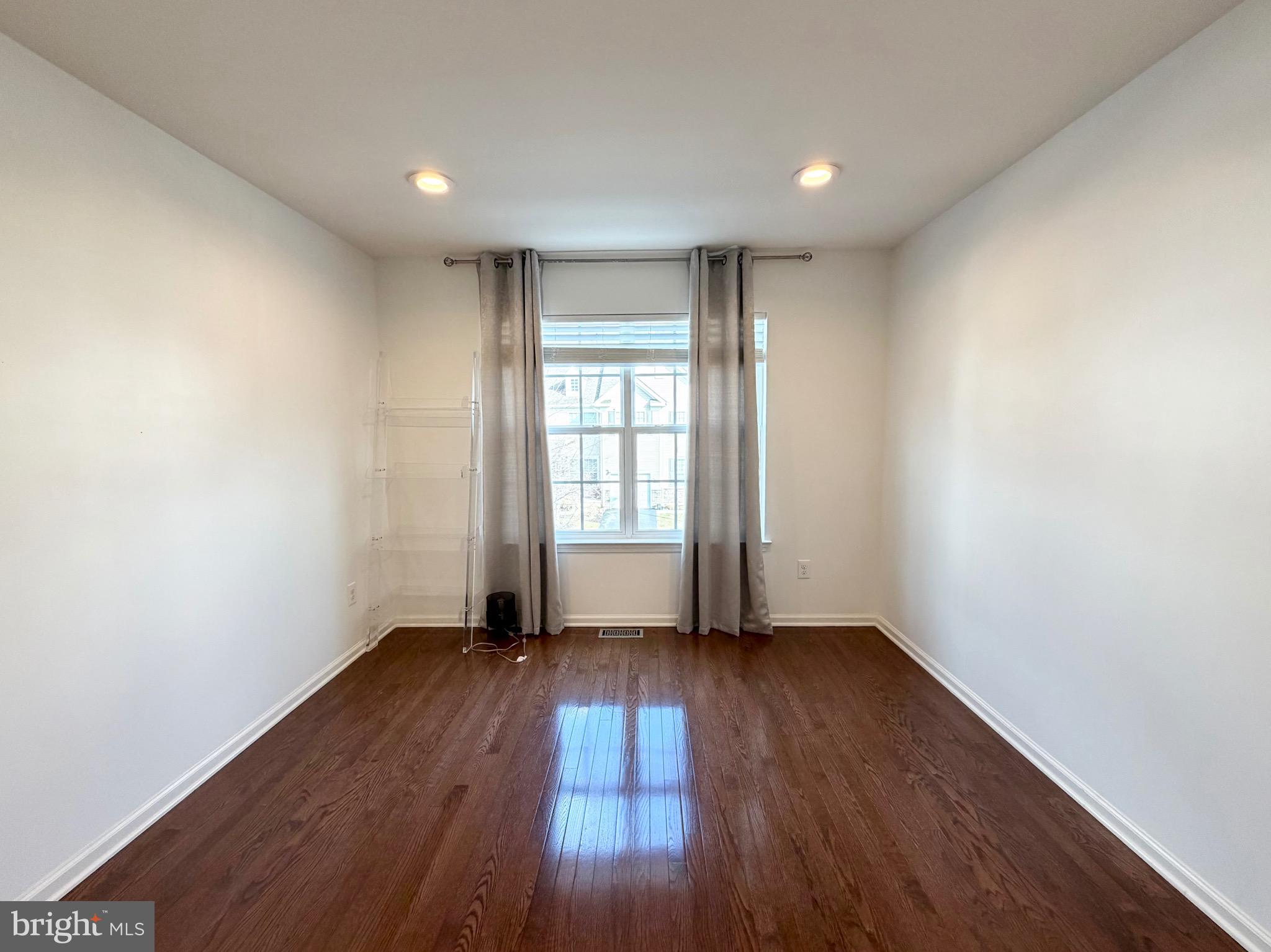308 Roarks Trail Warminster, PA 18974 - Photo 51 of 68 an empty room with wooden floor and windows