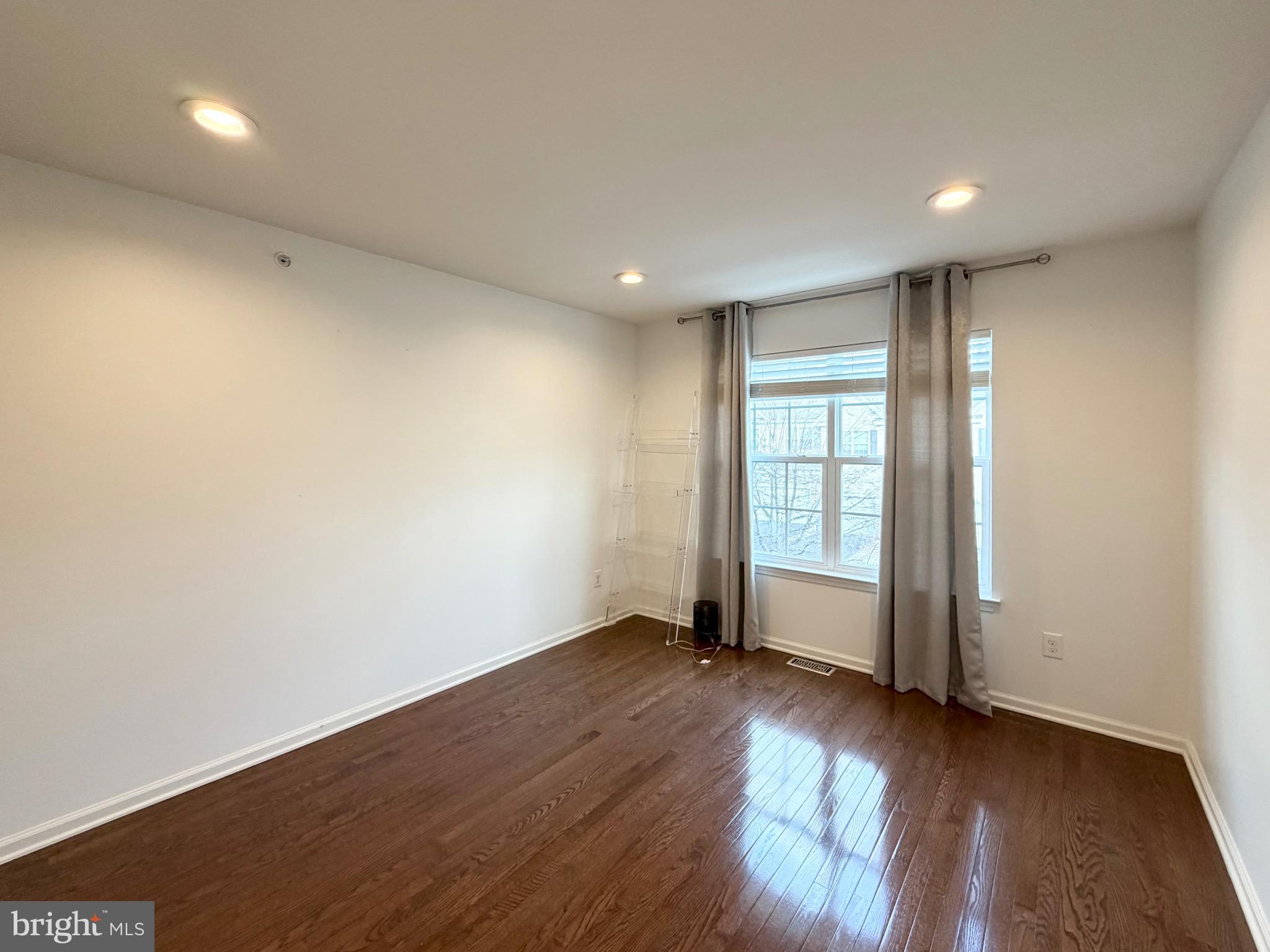 308 Roarks Trail Warminster, PA 18974 - Photo 53 of 68 an empty room with wooden floor and windows