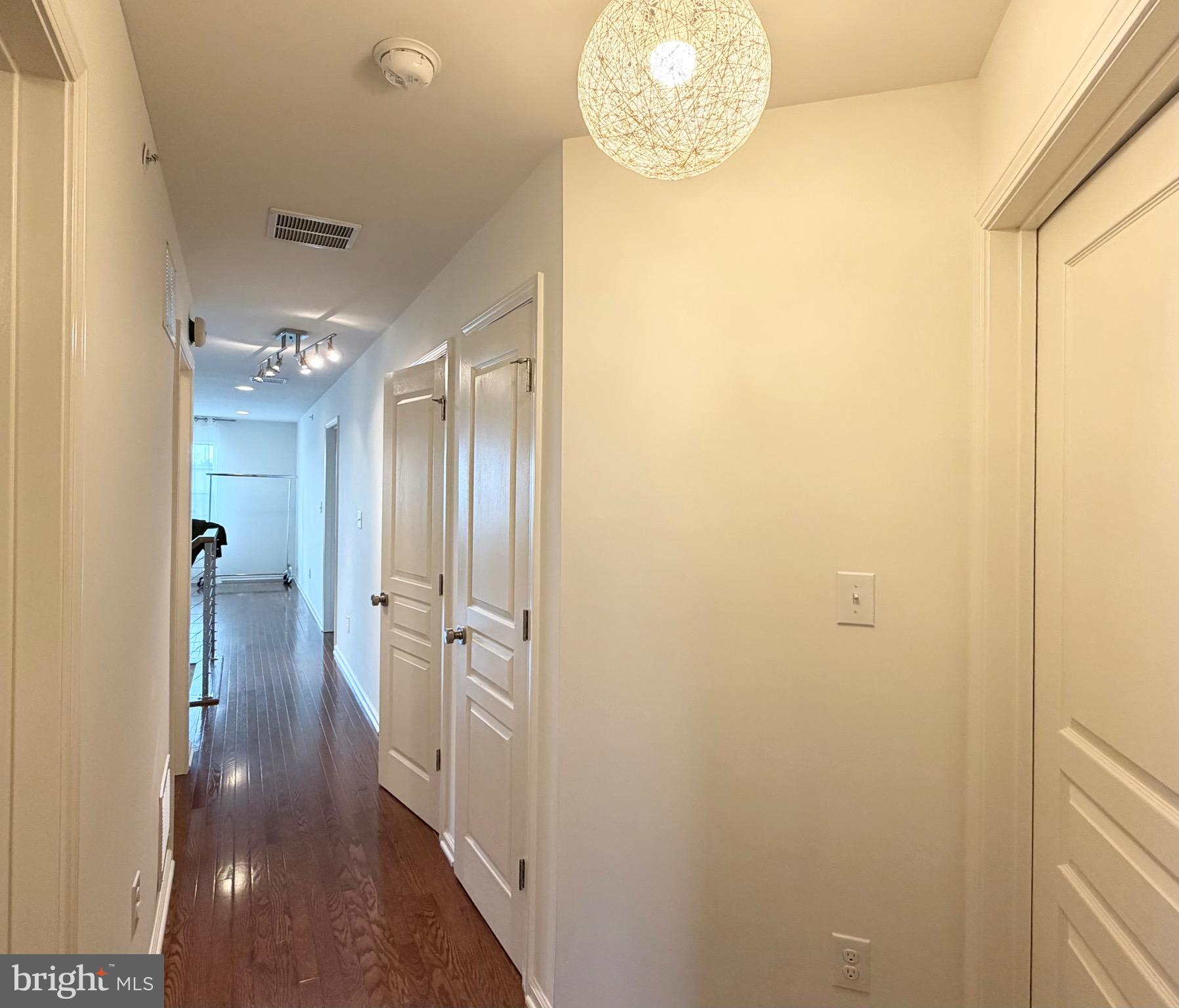 308 Roarks Trail Warminster, PA 18974 - Photo 54 of 68 a view of a hallway with wooden floor