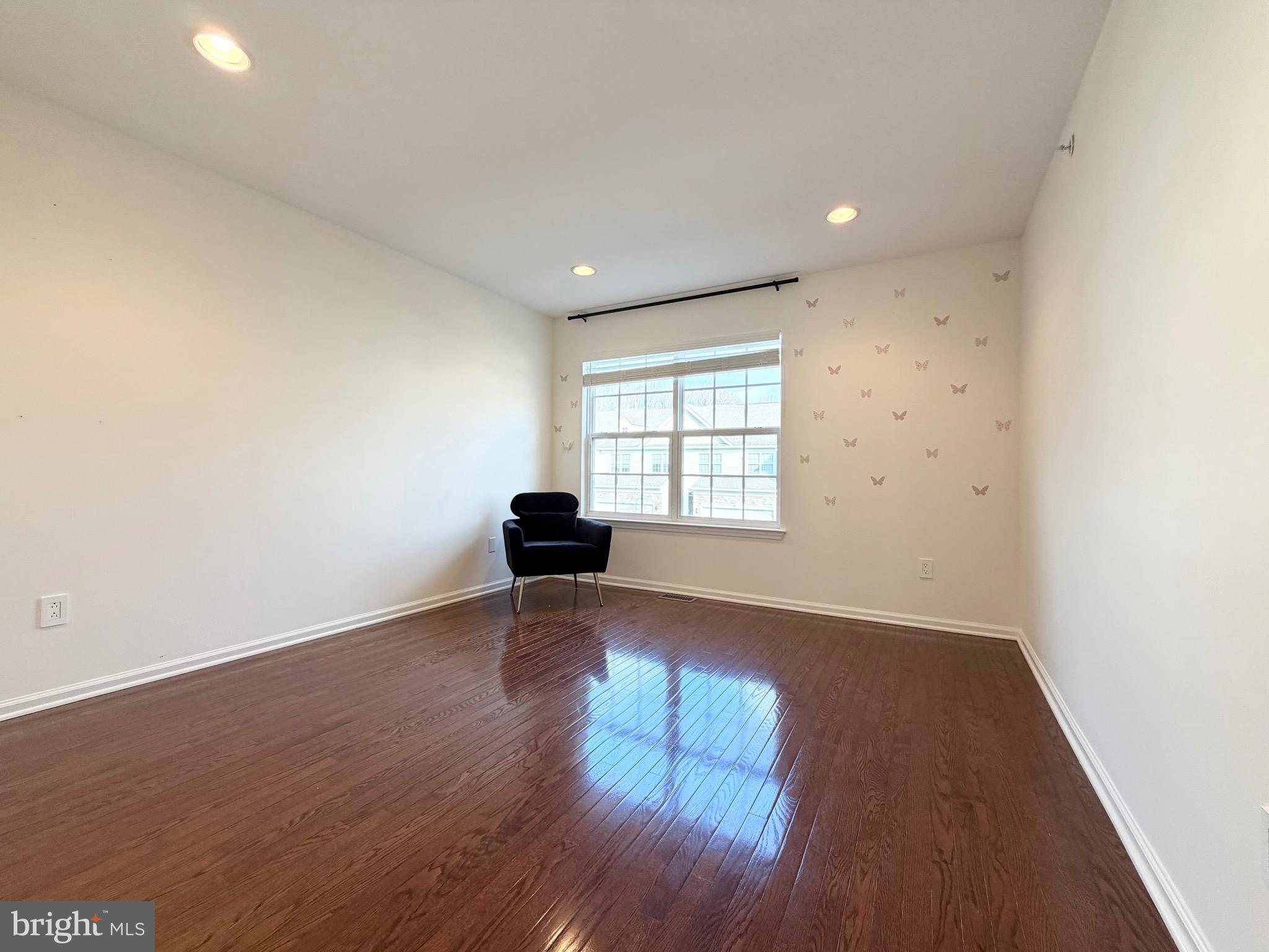 308 Roarks Trail Warminster, PA 18974 - Photo 56 of 68 an empty room with wooden floor and windows