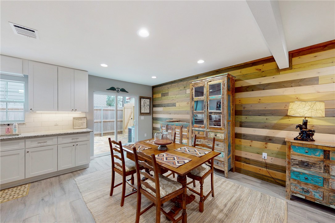 513 Boyett Street, Unit 2 College Station, TX 77840 - Photo 4 of 22 a kitchen that has a table and chairs in it
