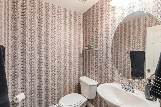 a view of a kitchen with microwave and cabinets