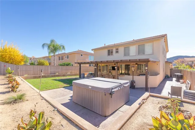 a dining room with furniture and a floor to ceiling window
