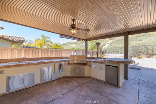 a living room with fireplace furniture and a large window