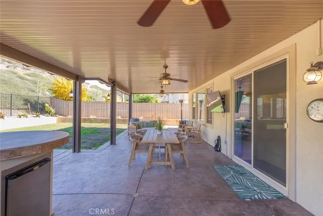 a outdoor space with patio the couches and a dining table with garden view