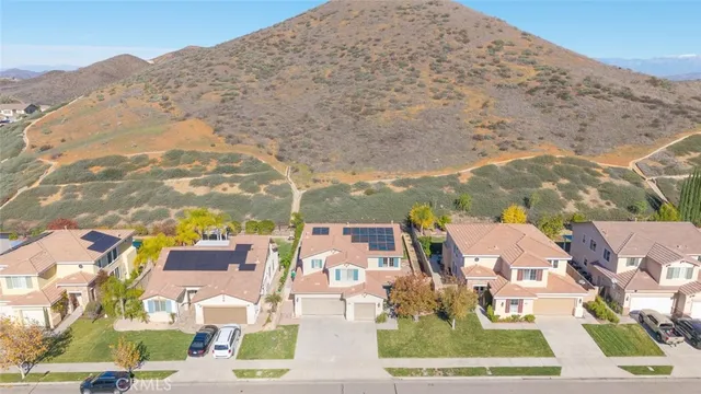 an aerial view of mountain with an ocean