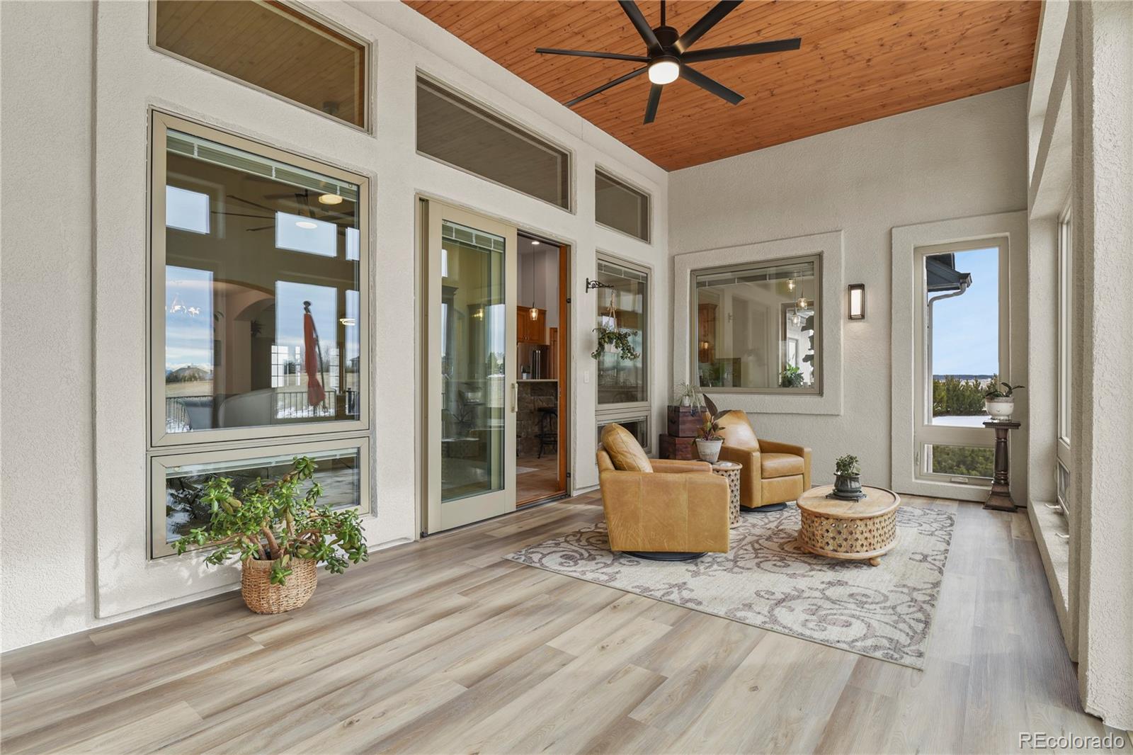 5220 Roundup Ridge Road Colorado Springs, CO 80908 - Photo 14 of 50 a view of a patio with couches and potted plants