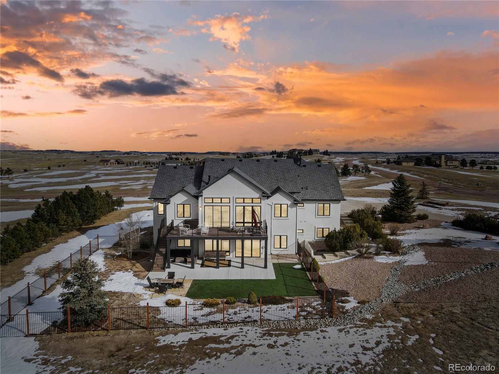 5220 Roundup Ridge Road Colorado Springs, CO 80908 - Photo 3 of 50 a view of a house with a yard
