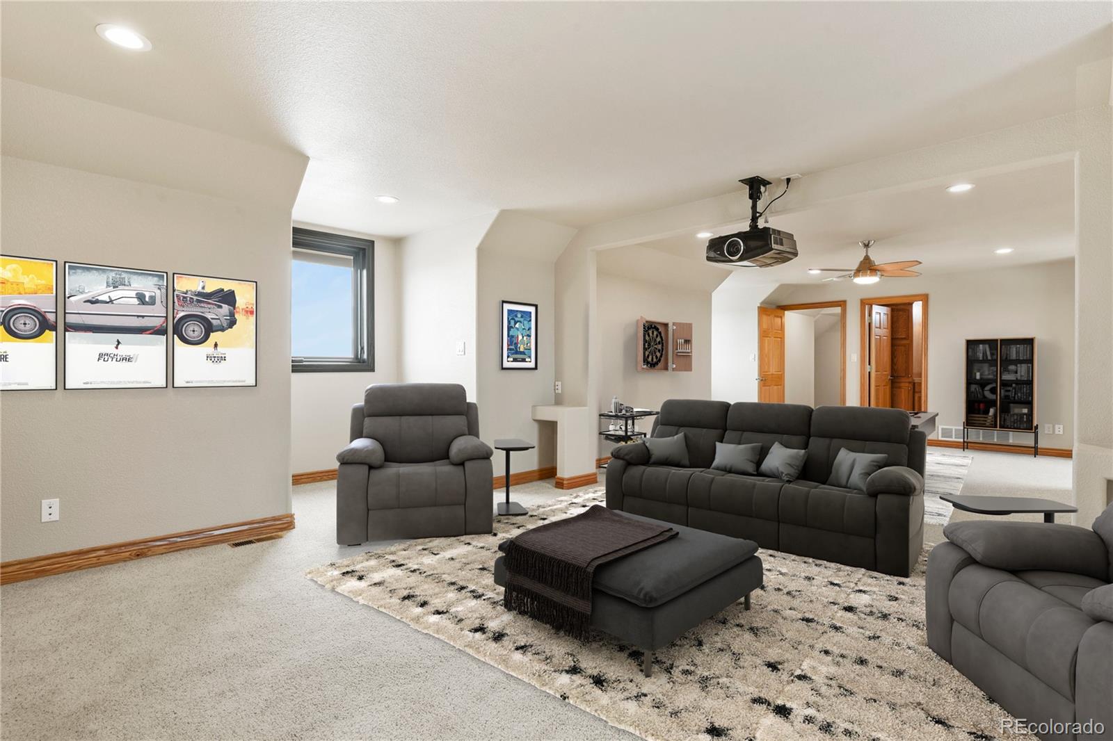 5220 Roundup Ridge Road Colorado Springs, CO 80908 - Photo 34 of 50 a living room with furniture and a large window