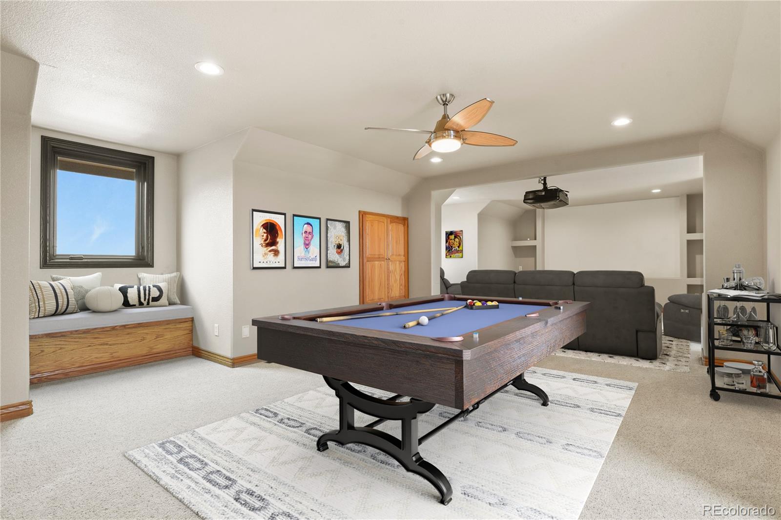 5220 Roundup Ridge Road Colorado Springs, CO 80908 - Photo 35 of 50 a living room with furniture a rug and a chandelier